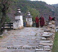 Monks at the entrance to the Paro Dzong