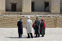 People in front of the Mir-Arab Madrasah.