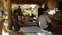  The road between Pak Xeng and Luang Prabang. Lunch break in a small village