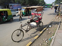 Tired Rickshaw drivers along the road to Connaught Place, Delhi 2013