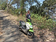 Peter at his scooter at a stop at Talpona
