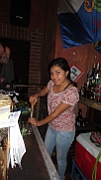 The bartender at the local bar in Antiqua make a Mojito.