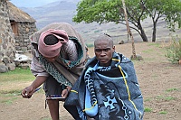 Young man from the Basotho people (Blanket people) get their hair cut.