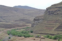 The scenery from the village No. 10 Riverside. Lesotho lies largely in the Drakensberg Mountains and the lowest point in Lesotho is about 1400m and the highest is Mount Thabana Ntlenyana 3 482m.