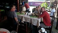 Bernt, Ulf and Thomas eats lunch at the little square.