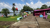 The main street along the river Rio Tortuguero in Tortuguero village.